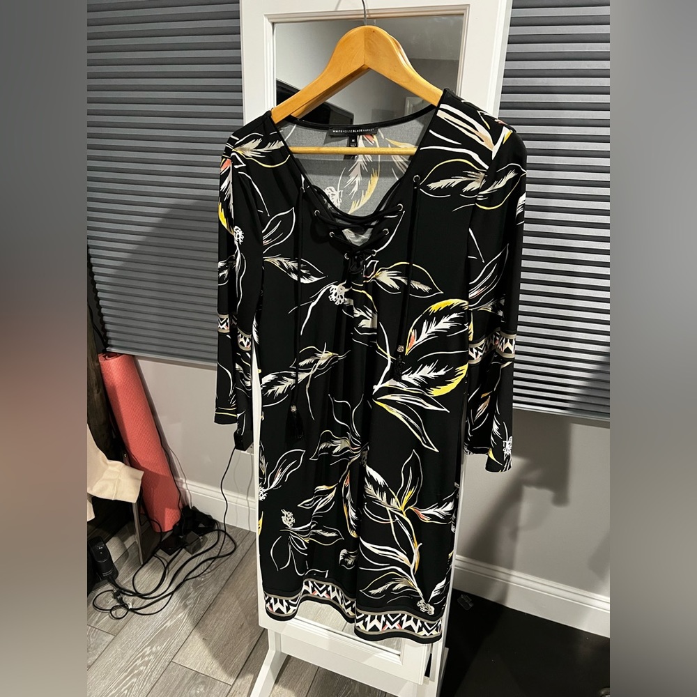 Black dress with floral print. Tie from v-neck line. Work once. Like new.